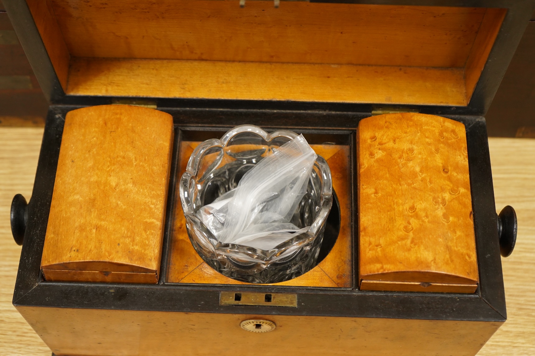 A bird’s-eye maple tea caddy and a brass mounted writing slope, latter 50cm wide